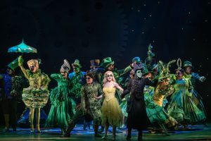 Cast Members of WICKED during a musical number. 