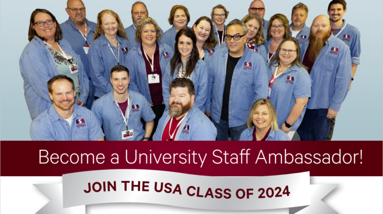 A group of people wearing denim shirts stand in front of a blue background. Become a University Staff Ambassador! Join the USA Class of 2024.