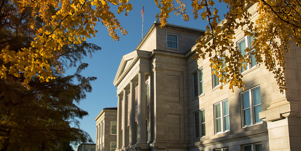 Early morning autumn light in front of Carrington Hall