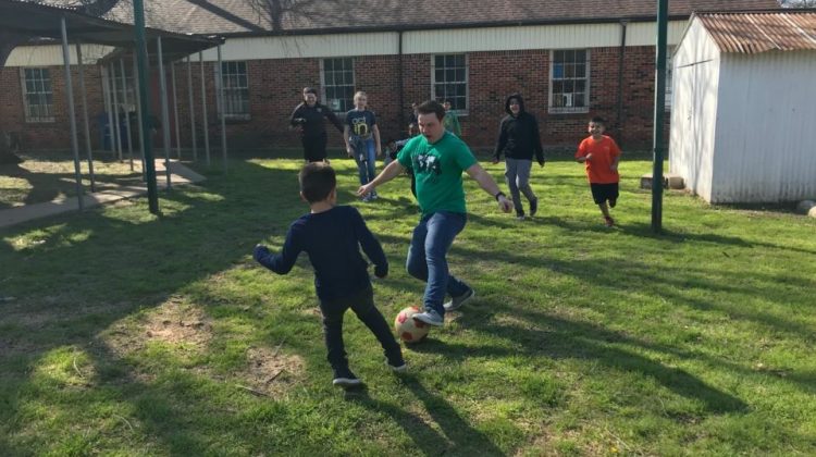 This picture shows our group playing soccer side by side with the children of Wesley Rankin