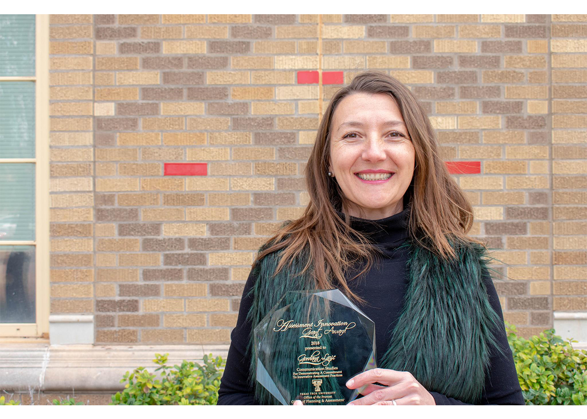 Photo of Dr. Gordana Lazić with an award (Photo Credit: Texas Tech University)