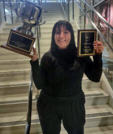 Lauren Woodall poses with her trophies.