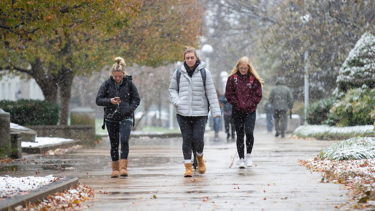 Students walking on a snowy campus
