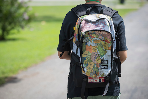 international student backpack with world map design represents international enrollment