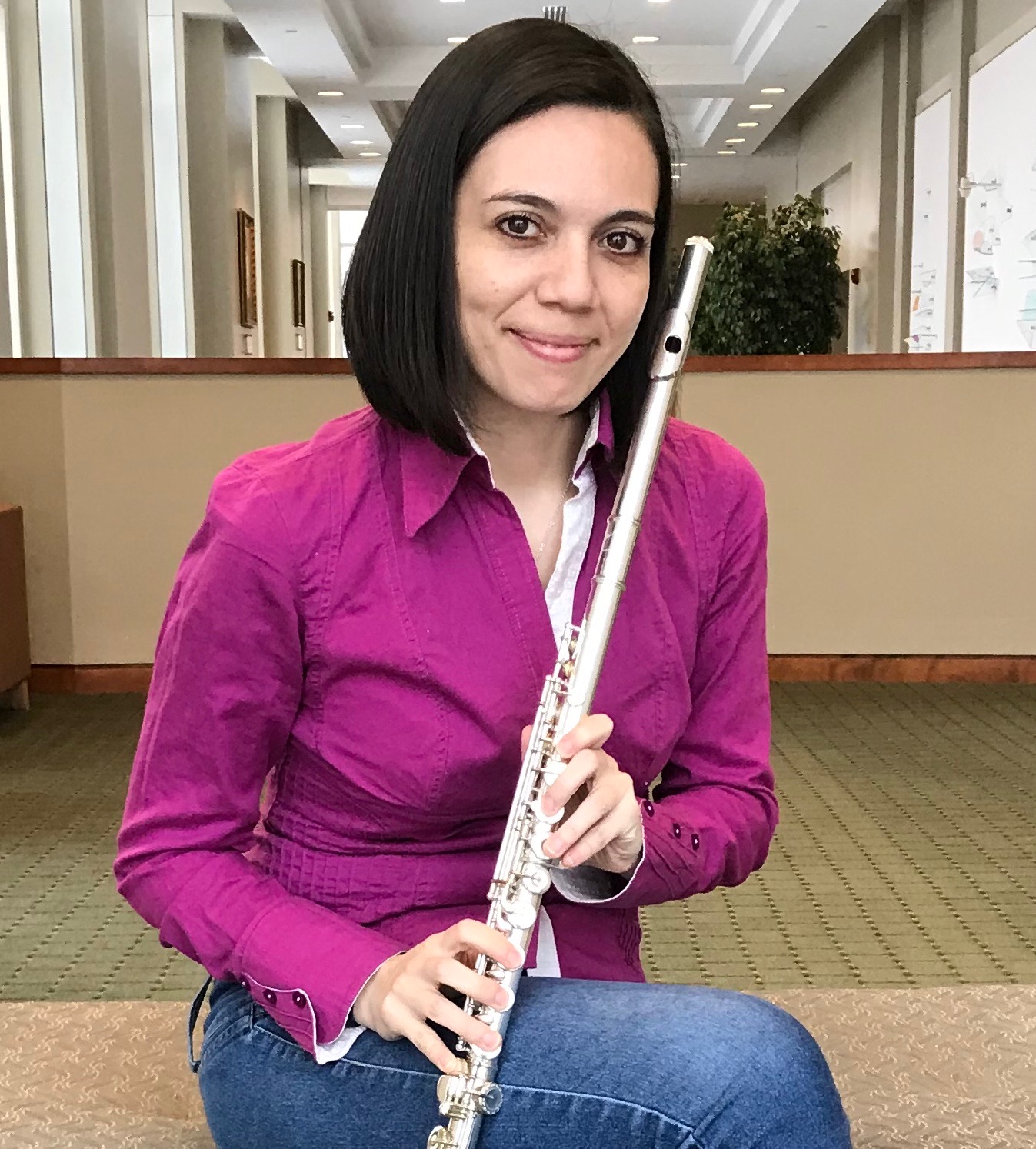 student holding a flute