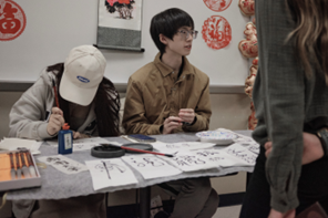 Students doing calligraphy