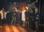 An undated image of drag queens gathering onstage for a show.