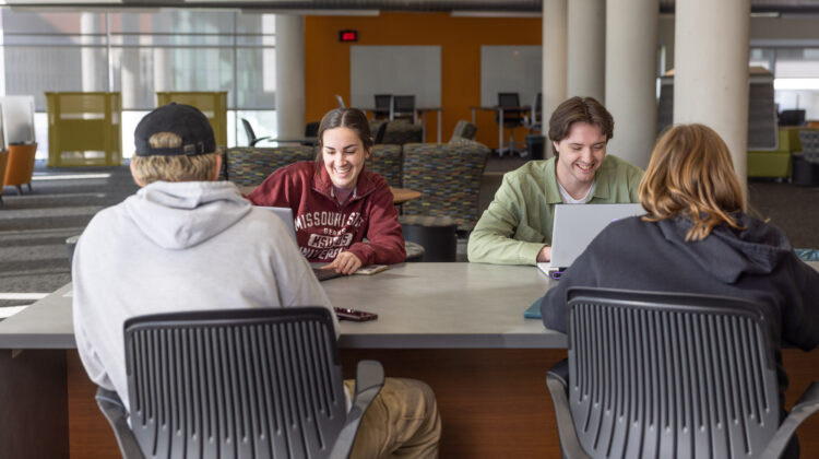 Students study and laugh on the second floor of Meyer Library