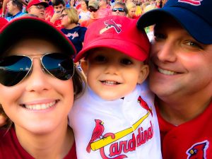 Danielle and her family at a cardinals game