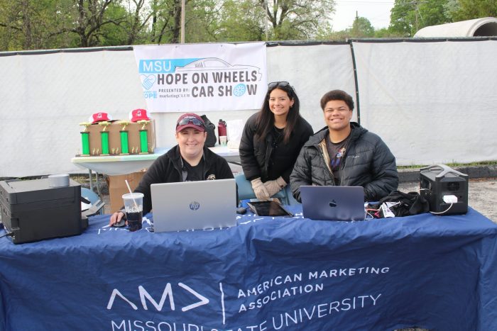 Dr. Skiba poses with AMA Springfield student members at the 13th Annual Hope on Wheels Car Show.