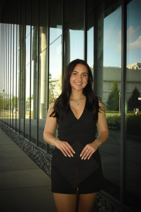 Brenna Breitenstein smiling in a graduation portrait as she celebrates completing her studies at Missouri State University and preparing to begin her career with Rapid Locking System.