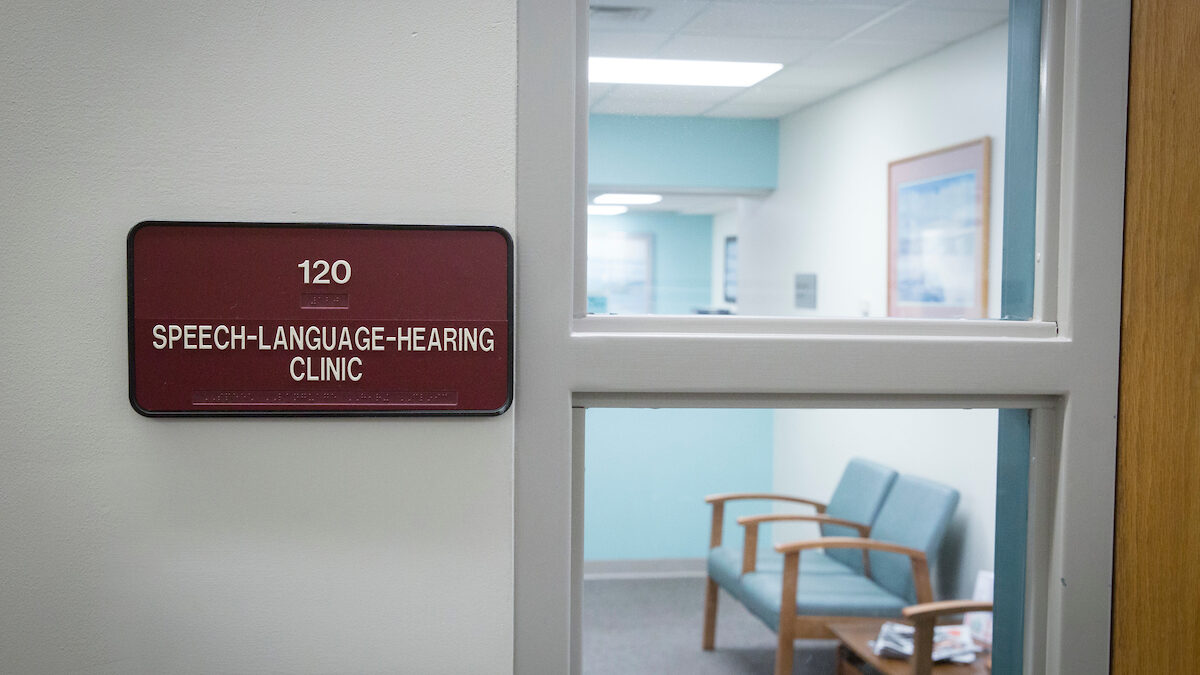 Sign outside door that reads "Speech-language-hearing clinic"