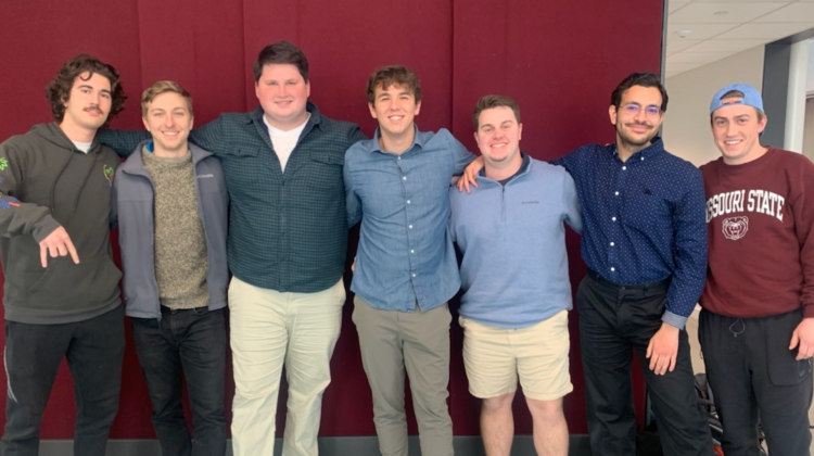 Seven male nursing students pose together