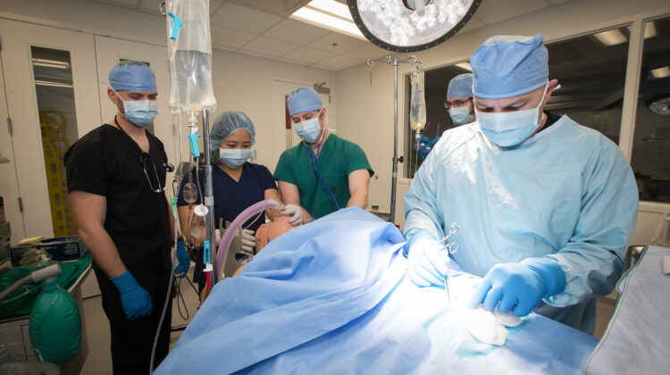 Nursing students practice with dummies in the Anesthesia program.