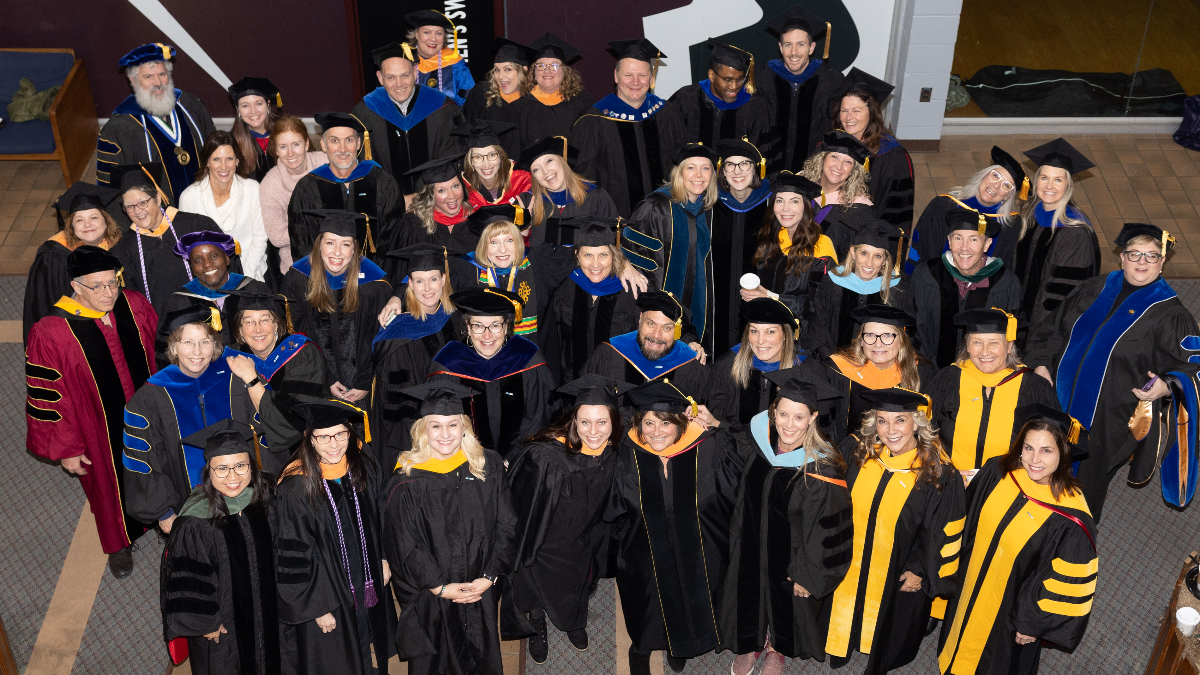 Professors and faculty wearing graduation gear
