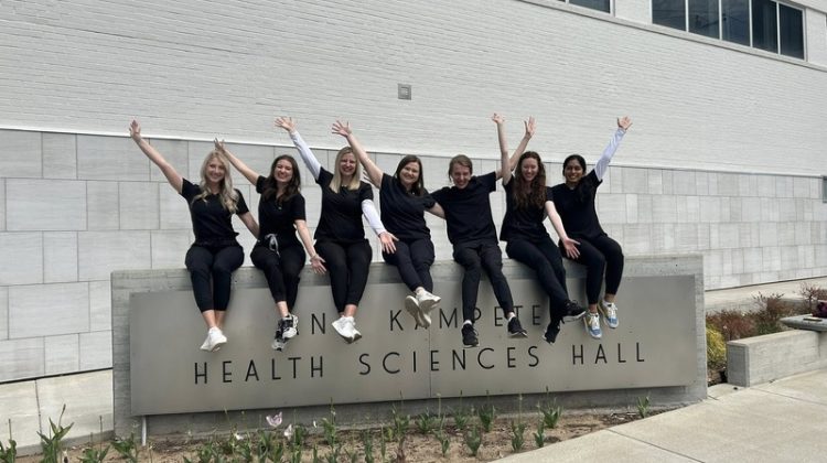 James Buechter (third from right) with his audiology cohort outside Kampeter Health Sciences Hall.