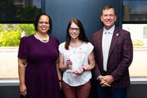 Penkalski with her award (center). With her are Missouri State University President Richard B. Williams (right) and Provost Dr. Clarenda Phillips (left).