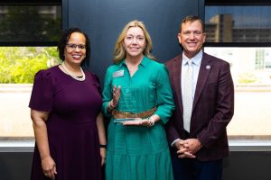 Boehne with her award (center). With her are Missouri State University President Richard B. Williams (right) and Provost Dr. Clarenda Phillips (left).