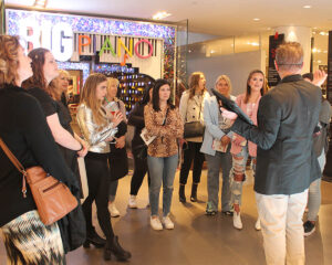 Students gathered around a tour guide.