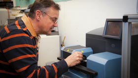 Dr. Gerasimchuk working on lab equipment