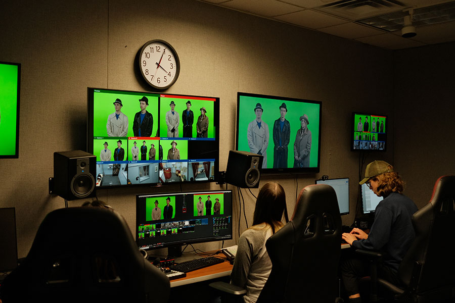 Students work in a TV control room.