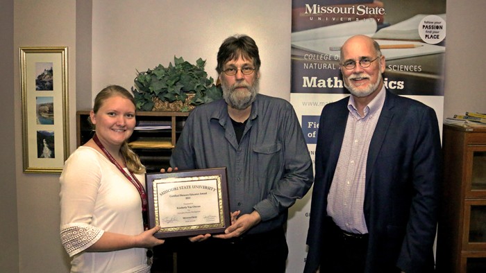 Kim Van Ornum accepting her certified distance educator award.