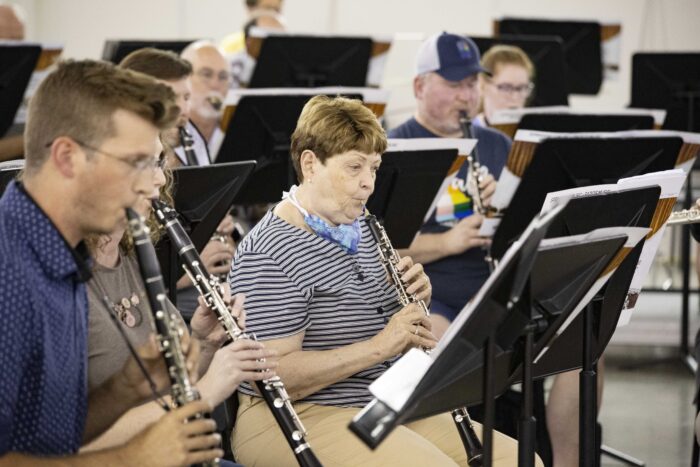 A group of senior students playing their flutes in the Wehr Band Hall