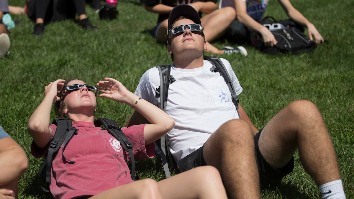 Students watch the solar eclipse