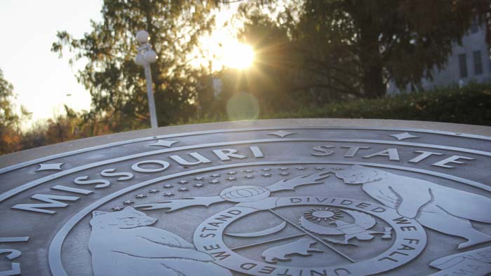 Missouri State University seal in front of Carrington Hall