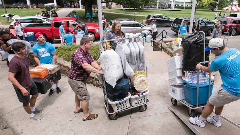 Staff and students assist with move in