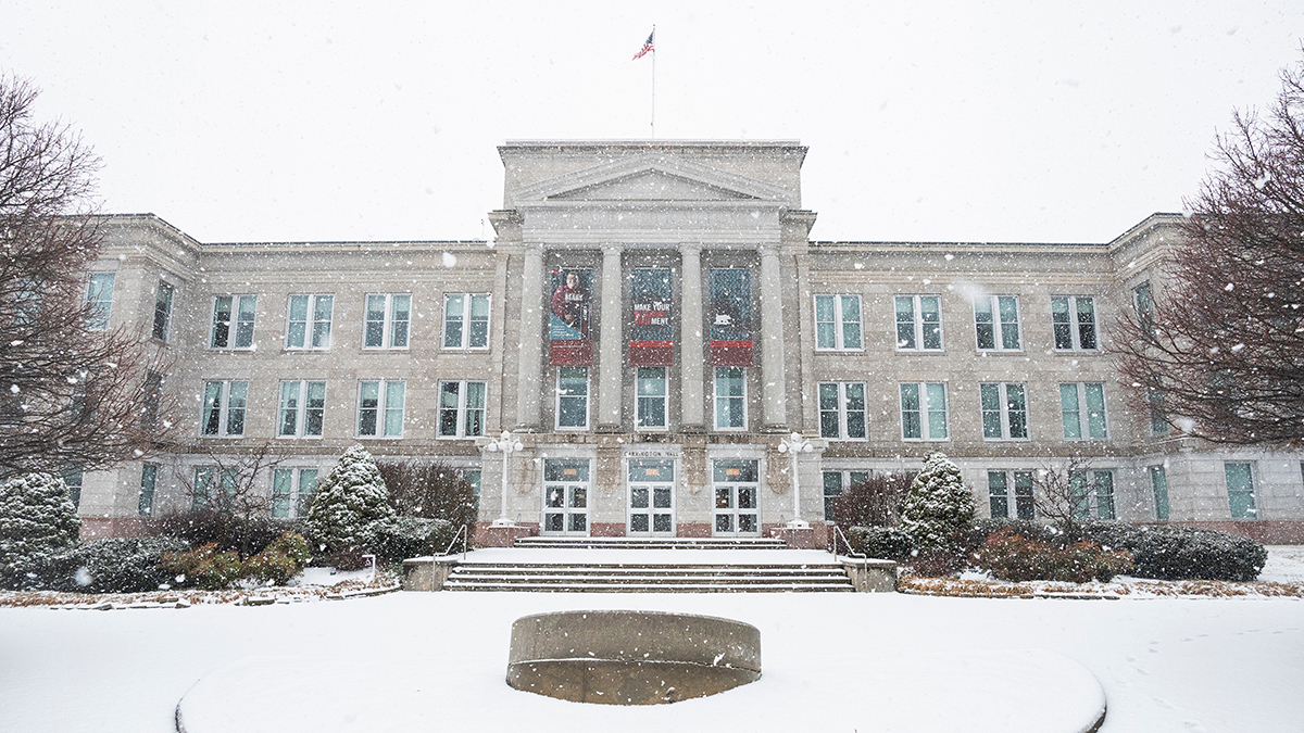 Snow falls on Carrington Hall