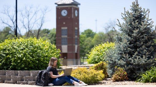Student sits studying on West Plains campus.