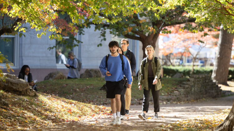 Students walking on Missouri State's campus on fall day.