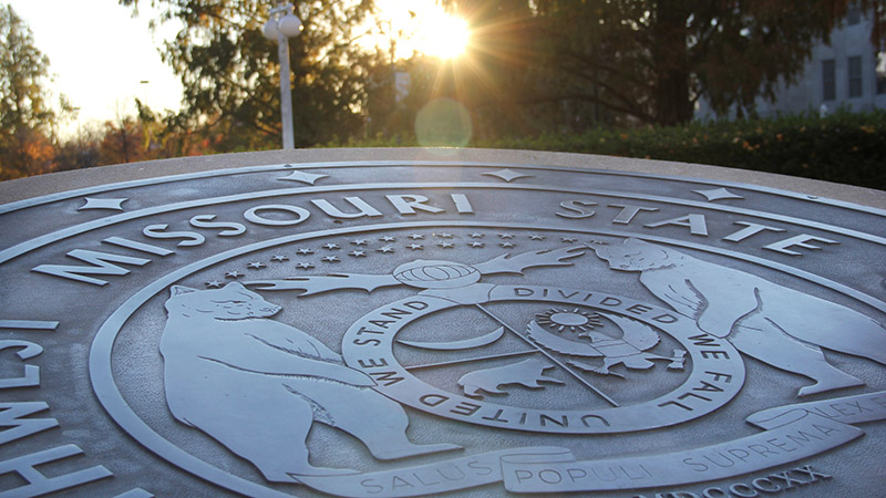 The sun shining on the Missouri State seal.