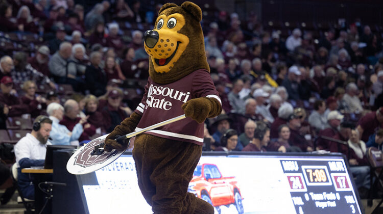 Boomer at a basketball game in Great Southern Bank Arena.