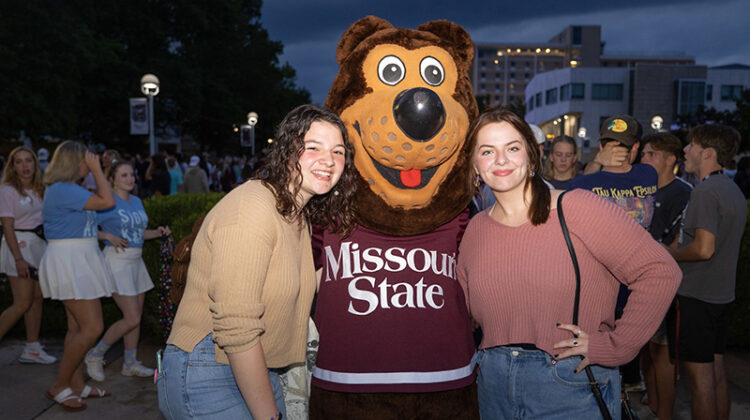 Boomer Bear with students at Bear Bash.