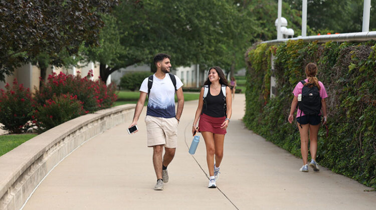 A few students walk on campus.