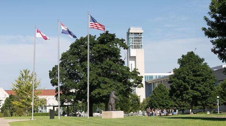 View of flags and the Carillon on a summer day on campus.