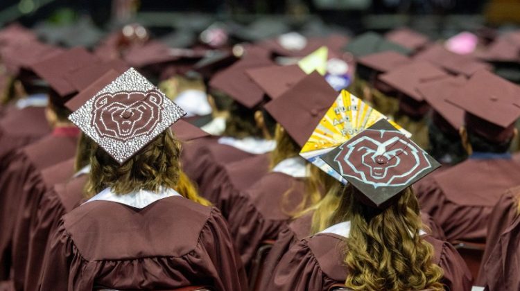 A group of Missouri State University students at a commencement ceremony.