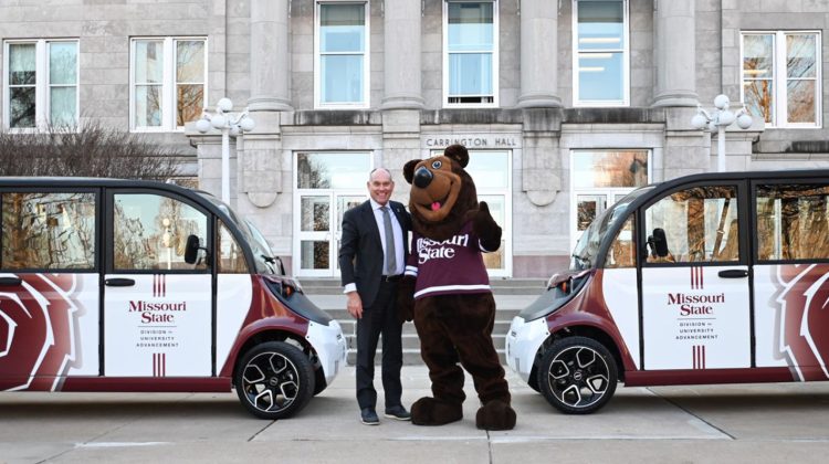 Brent Dunn and Boomer in front of Carrington Hall.