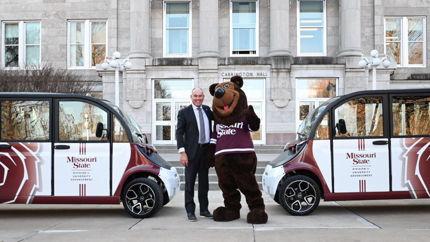 Brent Dunn and Boomer in front of Carrington Hall.