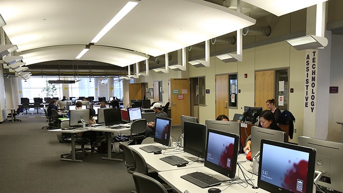 Students working on computers in the assistive technology center