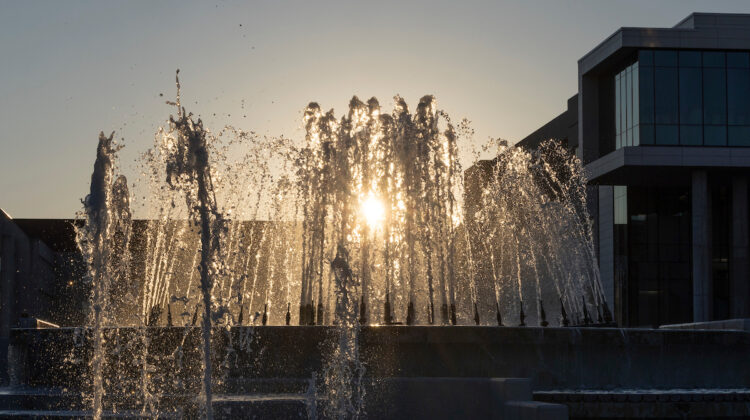 The Missouri State fountain, seen from below at sunset, with Glass Hall in the background