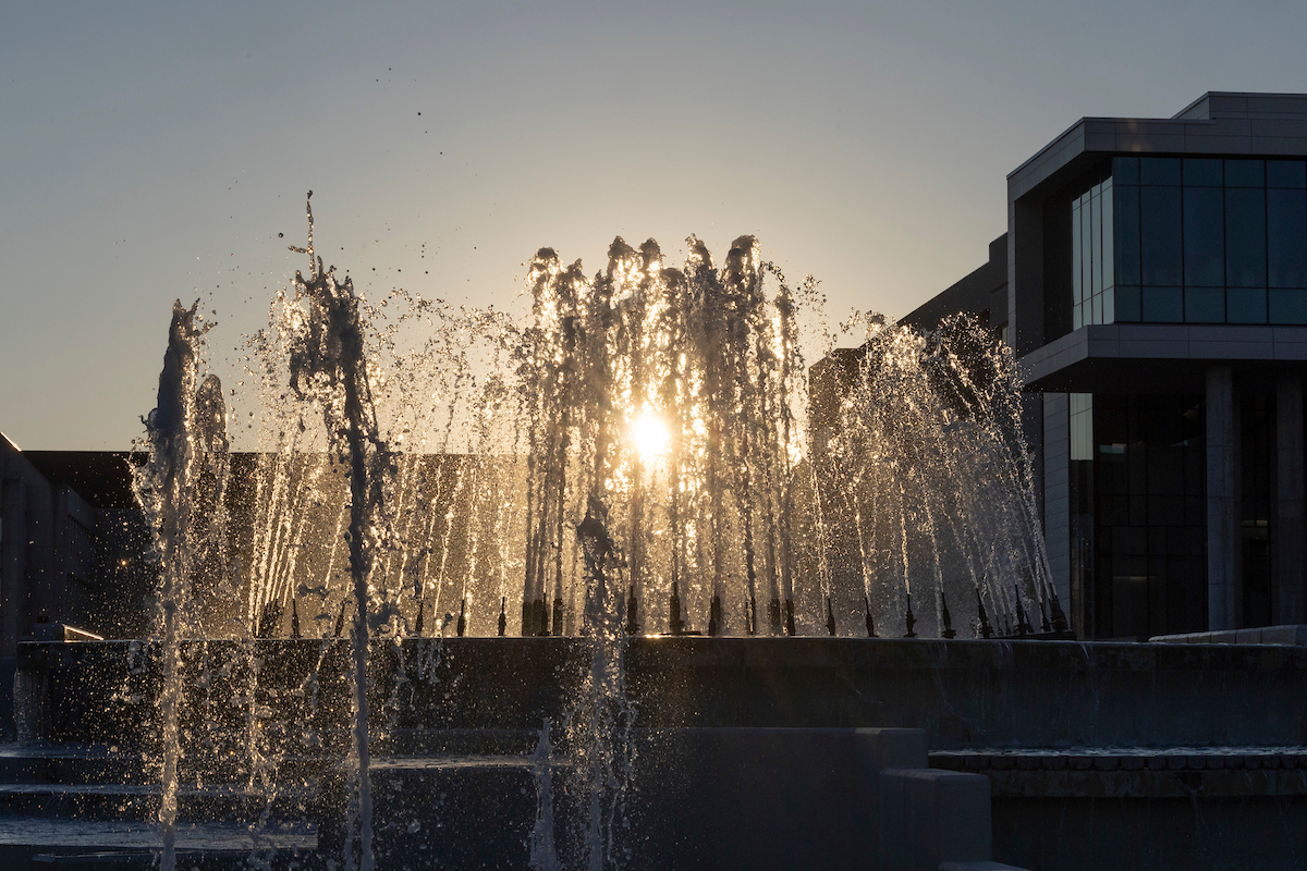 The Missouri State fountain, seen from below at sunset, with Glass Hall in the background