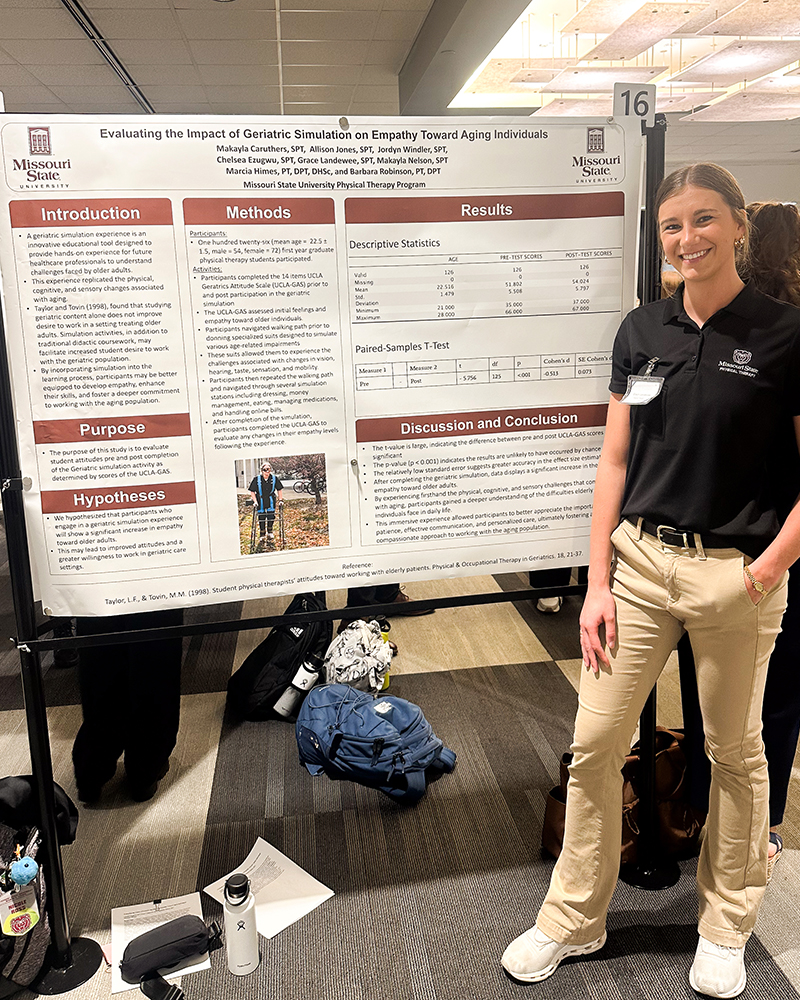 Student standing with her research presentation at the MCHHS Student Research Symposium.