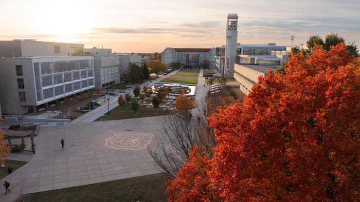 Aerial view of Missouri State University's West Mall, with vibrant fall foliage in the foreground. 