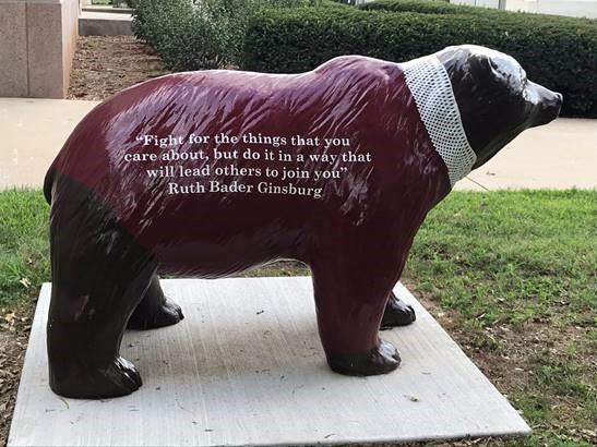 Bear Statue with quote. "Fight for the things that you care about, but do it in a way that will lead others to join you" -Ruth Bader Ginsburg