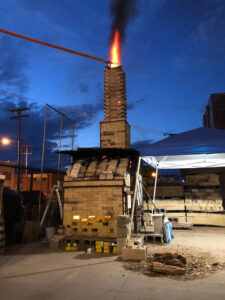 Wood kiln fire at night