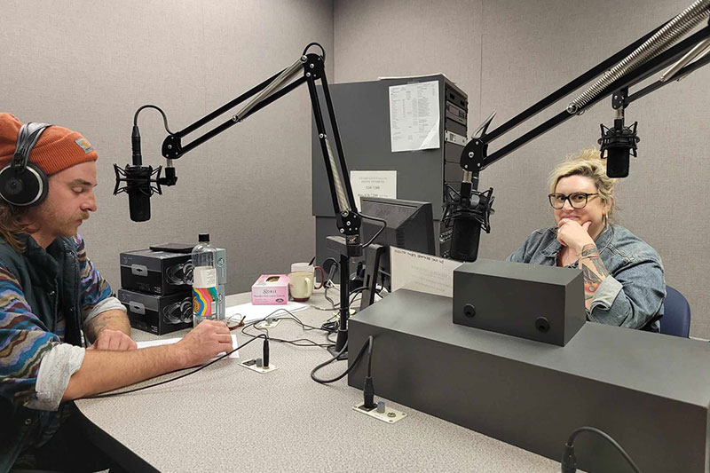 Man and woman in radio recording studio