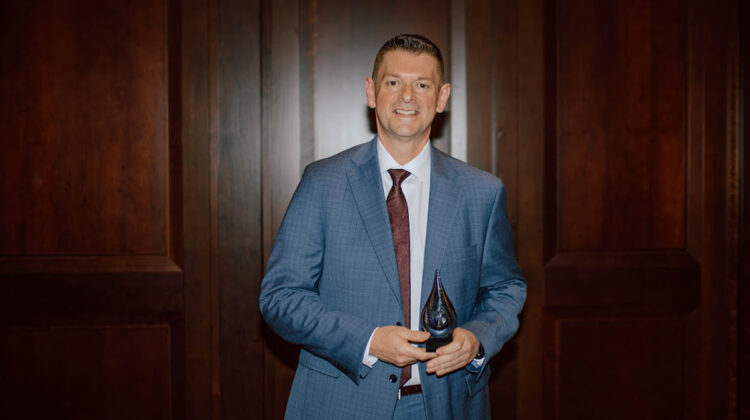 Dean Shawn Wahl poses with award